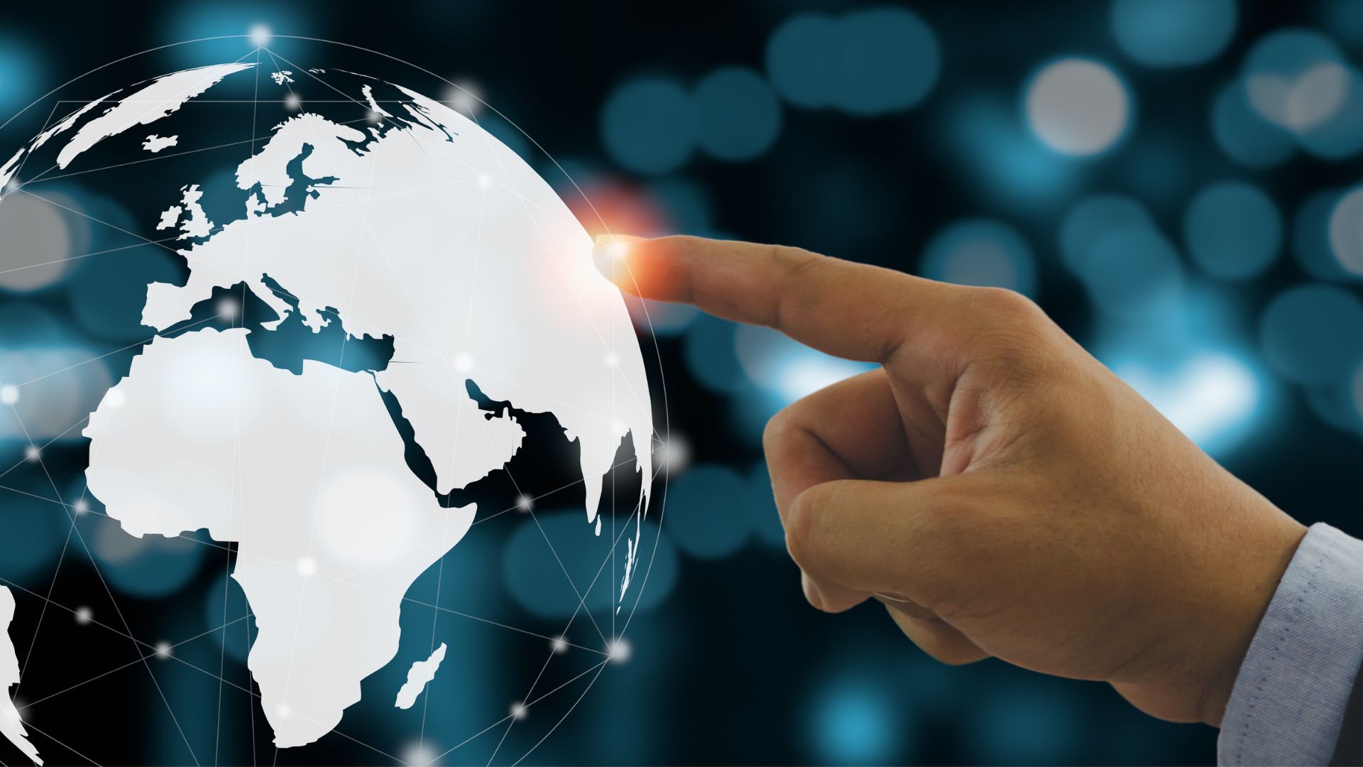 A hand pointing at a futuristic globe.