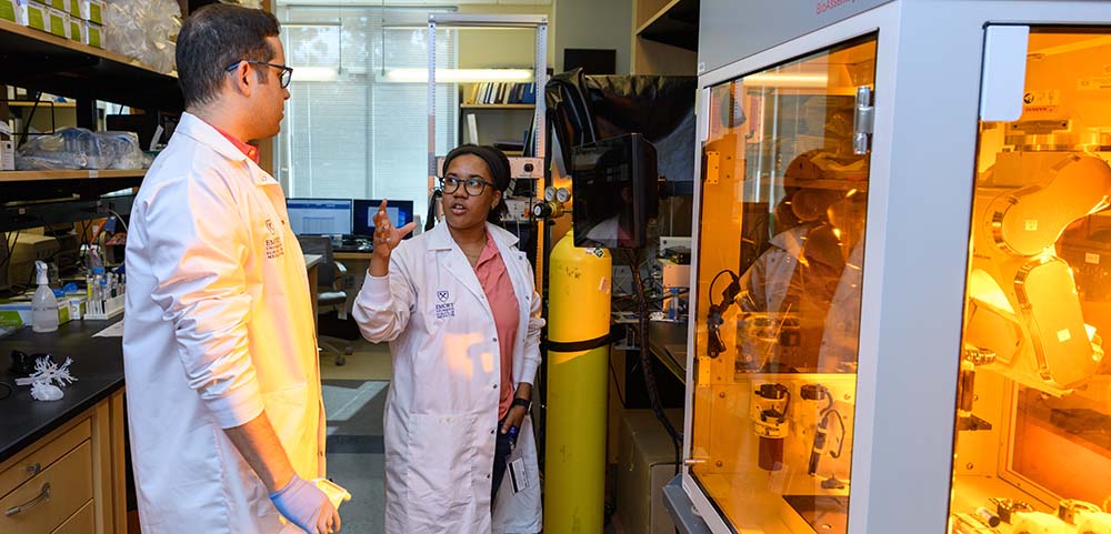 Two students doing research in a lab